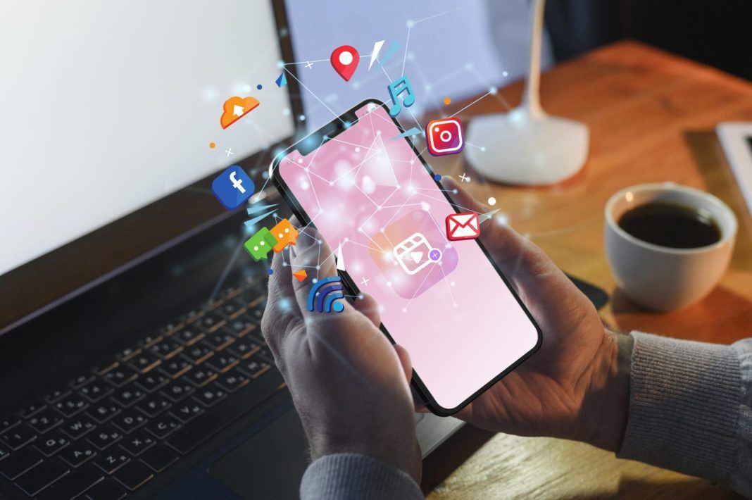 hands-holding-smartphone-social-media-concept-scaled-1